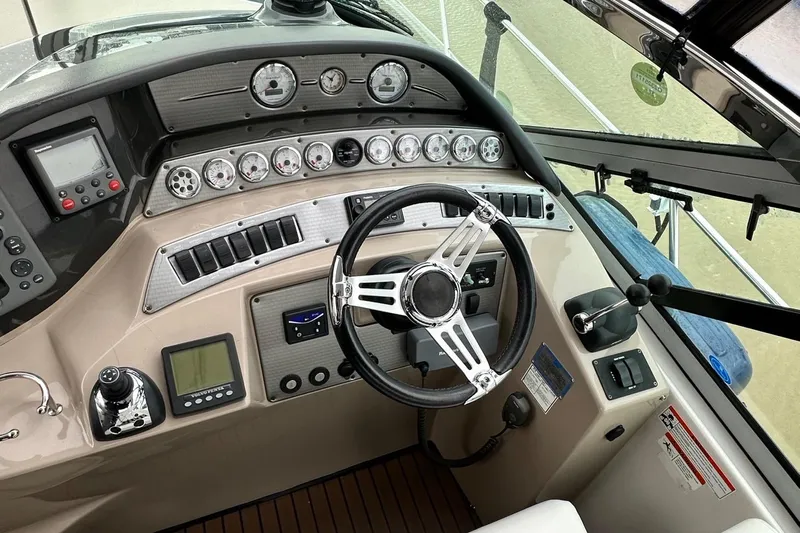  Yacht Photos Pics 2007 Four Winns 378 Vista boat dashboard with steering wheel and control gauges.