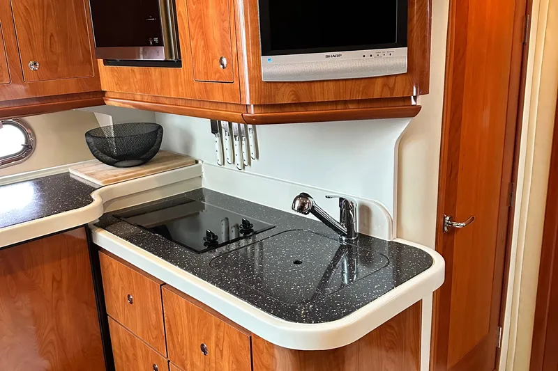  Yacht Photos Pics 2007 Four Winns 378 Vista yacht kitchen with sleek countertops and modern appliances.