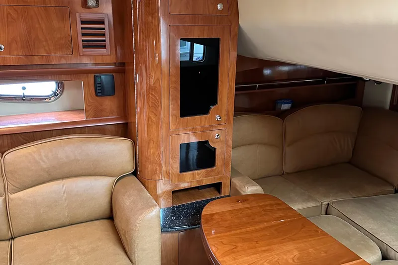  Yacht Photos Pics Interior of 2007 Four Winns 378 Vista yacht with wood finishes and beige seating.
