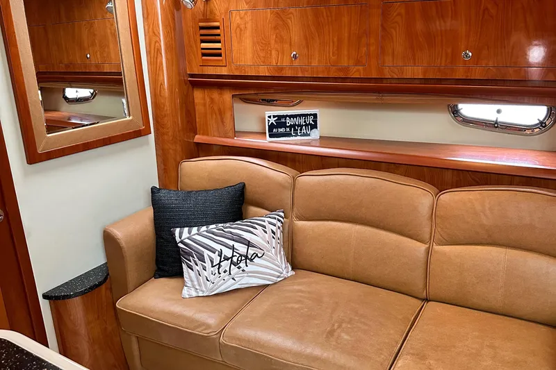  Yacht Photos Pics Luxurious interior of 2007 Four Winns 378 Vista yacht with leather seating and wooden cabinetry.