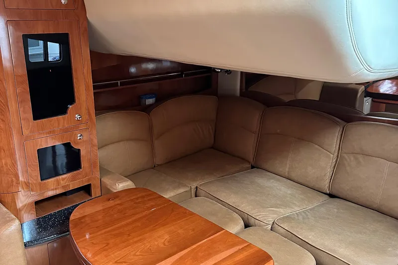  Yacht Photos Pics 2007 Four Winns 378 Vista yacht interior with plush seating and wooden cabinetry.