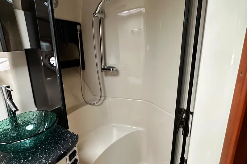  Yacht Photos Pics Luxurious bathroom in 2007 Four Winns 378 Vista yacht with modern fixtures and glass sink.