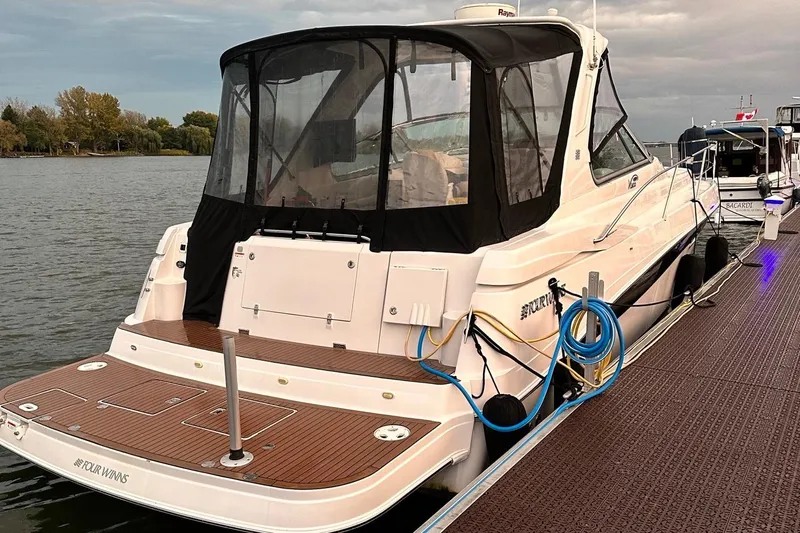  Yacht Photos Pics 2007 Four Winns 378 Vista boat docked by the water.