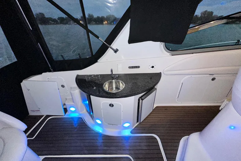  Yacht Photos Pics 2007 Four Winns 378 Vista boat interior with sink, blue LED lights, and wood flooring.