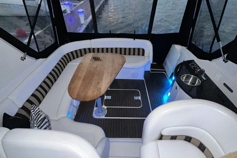  Yacht Photos Pics 2007 Four Winns 378 Vista yacht interior with seating, table, and kitchenette.