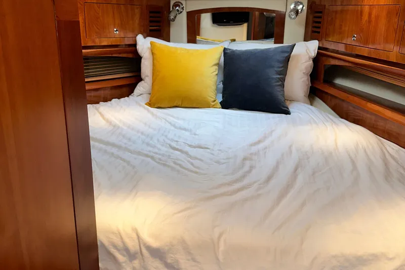  Yacht Photos Pics Cozy bedroom in 2007 Four Winns 378 Vista yacht with colorful pillows.