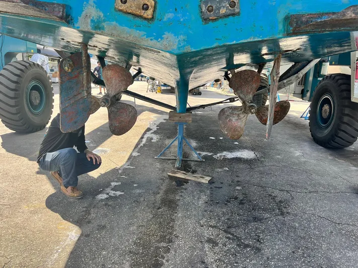 Sea Fever Yacht Photos Pics 1987 Symbol 44 Sun Deck MK II boat hull with propellers and rudders in dry dock.