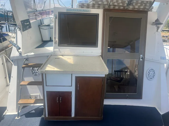 Sea Fever Yacht Photos Pics 1987 Symbol 44 Sun Deck MK II yacht interior with cabinetry and stairs.