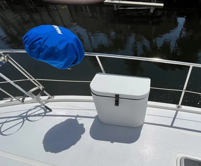 Sea Fever Yacht Photos Pics 1987 Symbol 44 Sun Deck MK II boat deck with blue cover and storage box.