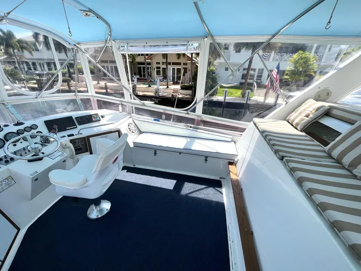 Sea Fever Yacht Photos Pics 1987 Symbol 44 Sun Deck MK II yacht interior with helm, seating, and panoramic windows.