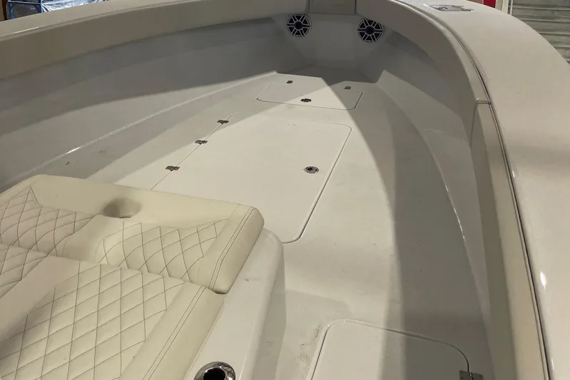  Yacht Photos Pics 2022 Conch 33 boat interior with cushioned seating and storage compartments.