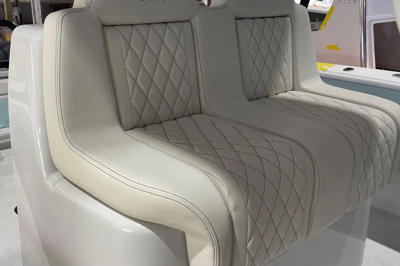  Yacht Photos Pics Luxurious beige seating on 2022 Conch 33 boat with diamond stitching design.