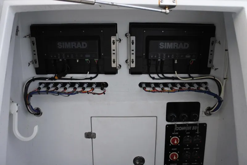  Yacht Photos Pics Electrical panel of 2022 Conch 33 boat with Simrad equipment and wiring.