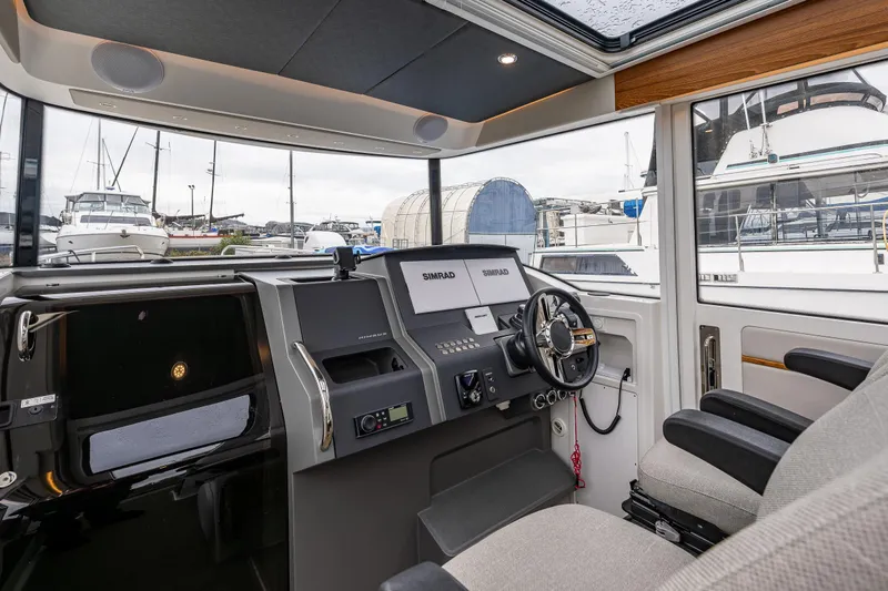 Rylea Rose Yacht Photos Pics Interior of 2021 Nimbus C11 boat cockpit with modern navigation equipment.
