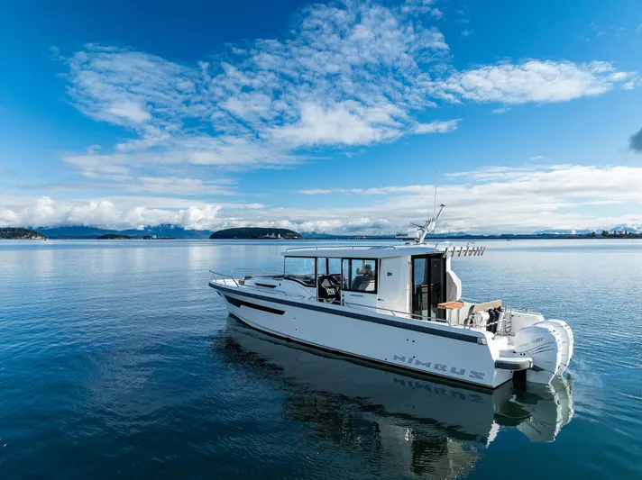 Rylea Rose Yacht Photos Pics Nimbus C11 2021 boat on calm water under a clear blue sky.