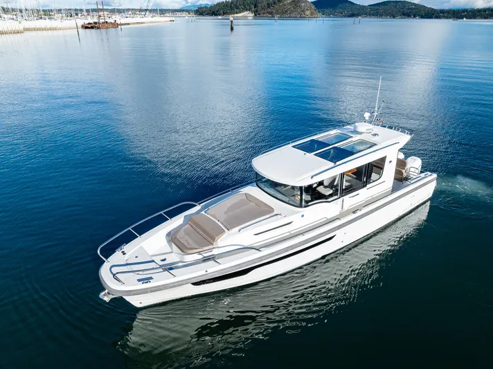 Rylea Rose Yacht Photos Pics 2021 Nimbus C11 boat cruising on calm waters with scenic background.