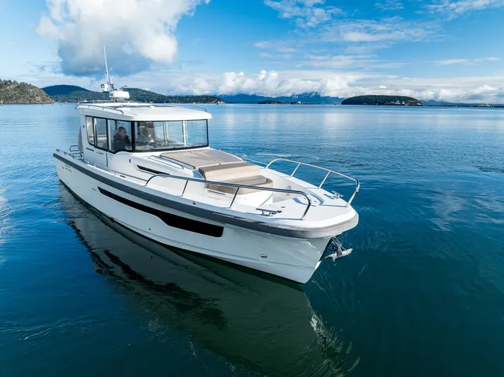 Rylea Rose Yacht Photos Pics Nimbus C11 2021 boat cruising on calm blue waters under a clear sky.