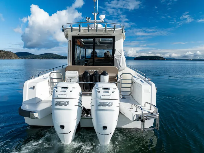 Rylea Rose Yacht Photos Pics Nimbus C11 2021 boat with twin outboard engines on a serene lake.