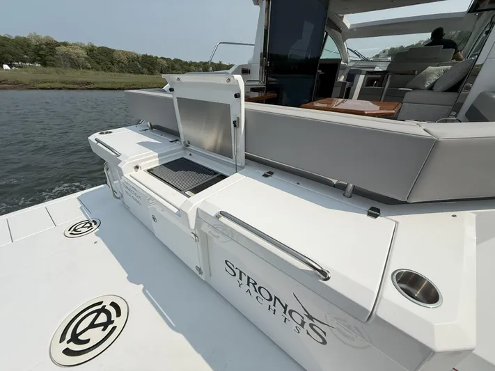 2023 Cruisers 42 Cantius Yacht Photos Pics 2023 Cruisers Yachts 42 Cantius with outdoor seating and grill on deck.