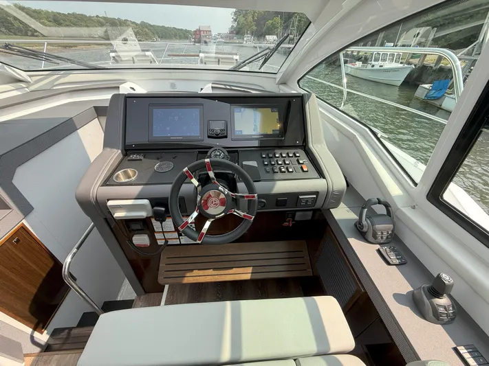 2023 Cruisers 42 Cantius Yacht Photos Pics 2023 Cruisers Yachts 42 Cantius helm with modern controls and navigation screens.