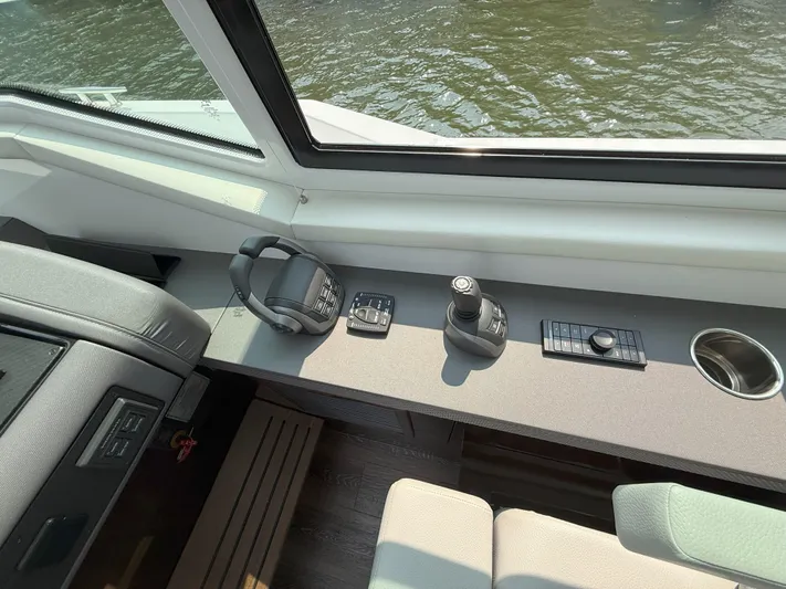 2023 Cruisers 42 Cantius Yacht Photos Pics 2023 Cruisers Yachts 42 Cantius helm with controls and water view.