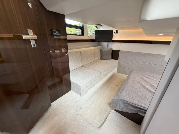 2023 Cruisers 42 Cantius Yacht Photos Pics 2023 Cruisers Yachts 42 Cantius interior cabin with modern seating and TV.