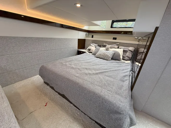 2023 Cruisers 42 Cantius Yacht Photos Pics Luxurious bedroom interior of 2023 Cruisers Yachts 42 Cantius with modern design and cozy bedding.