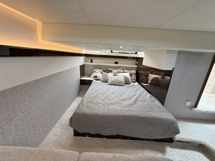 2023 Cruisers 42 Cantius Yacht Photos Pics Luxurious bedroom interior of 2023 Cruisers Yachts 42 Cantius with modern design and cozy bedding.
