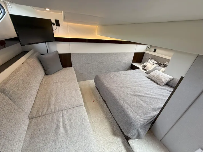 2023 Cruisers 42 Cantius Yacht Photos Pics Luxurious interior of 2023 Cruisers Yachts 42 Cantius with modern furnishings and cozy bedding.