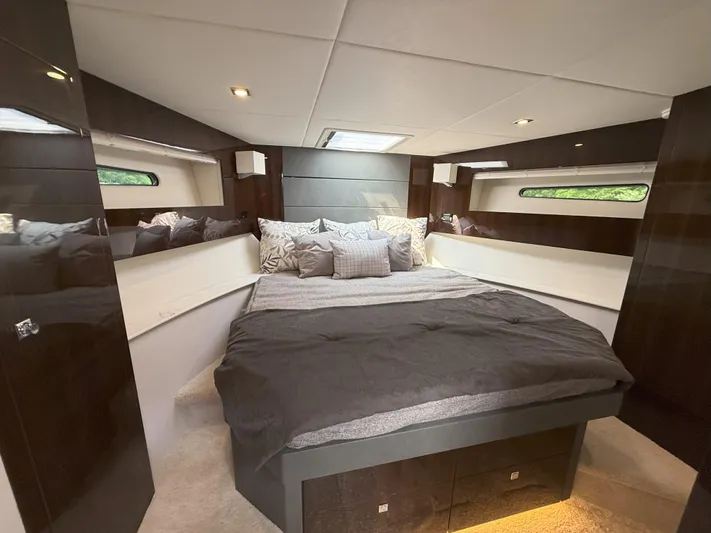 2023 Cruisers 42 Cantius Yacht Photos Pics Luxurious bedroom interior of 2023 Cruisers Yachts 42 Cantius with modern design and cozy bedding.