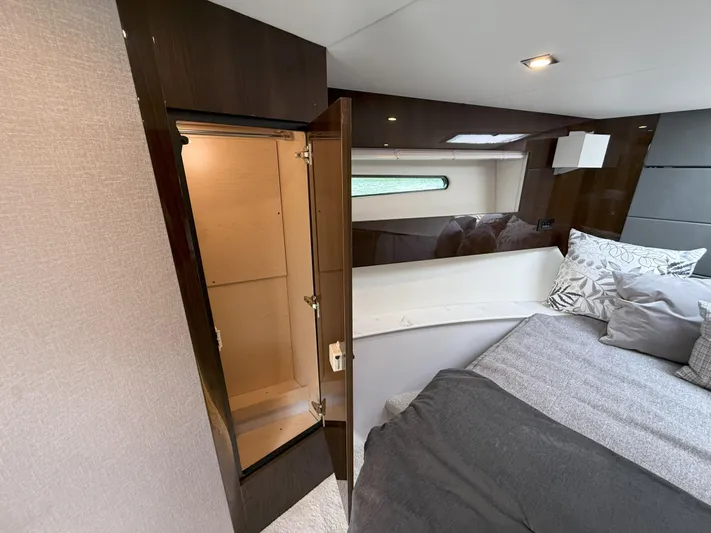 2023 Cruisers 42 Cantius Yacht Photos Pics 2023 Cruisers Yachts 42 Cantius interior with open closet and cozy bed.