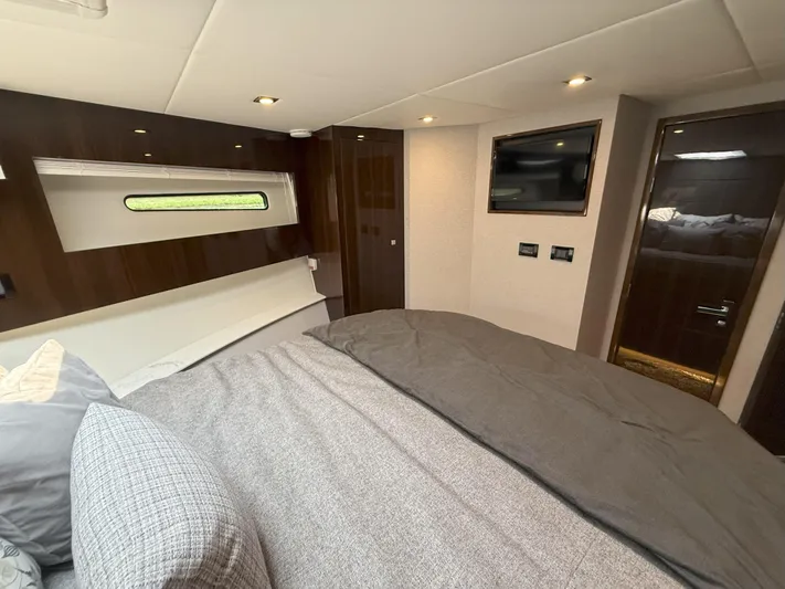 2023 Cruisers 42 Cantius Yacht Photos Pics Luxurious bedroom interior of 2023 Cruisers Yachts 42 Cantius with modern design and cozy bedding.