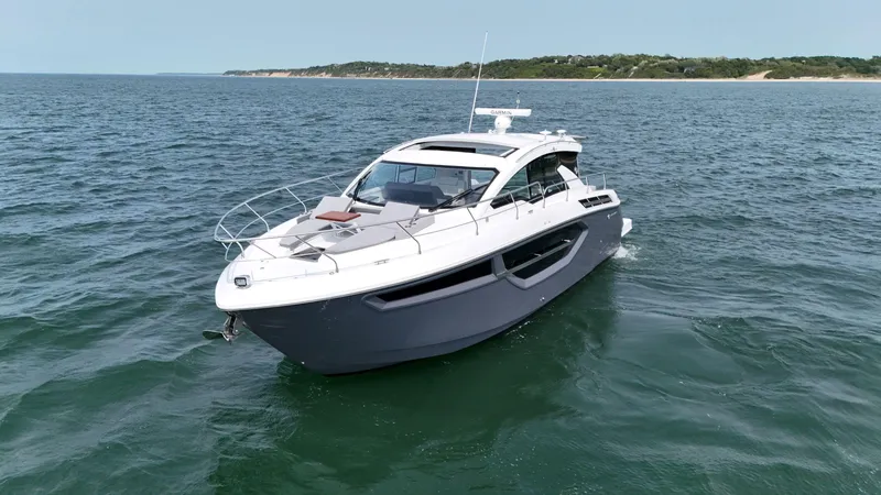 2023 Cruisers 42 Cantius Yacht Photos Pics 2023 Cruisers Yachts 42 Cantius cruising on open water, showcasing sleek design and luxury.