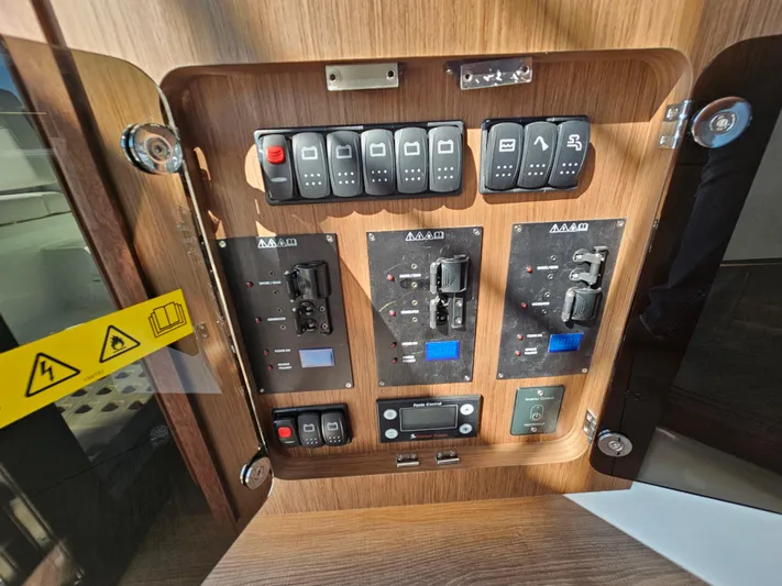  Yacht Photos Pics Electrical control panel on 2024 Beneteau Antares 12 boat, featuring switches and indicators.