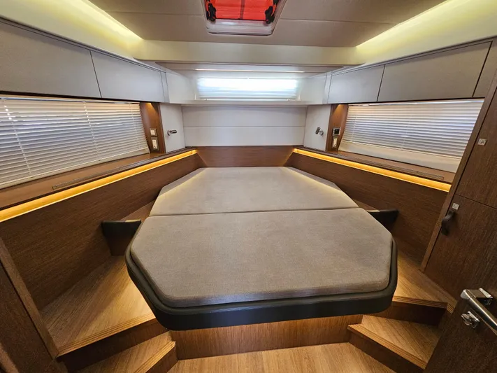  Yacht Photos Pics Luxurious cabin interior of 2024 Beneteau Antares 12 with modern design and ambient lighting.