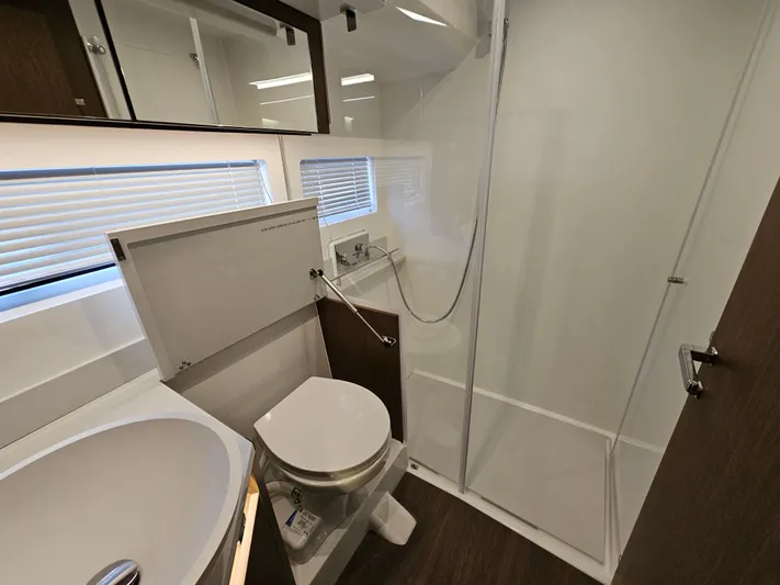  Yacht Photos Pics Bathroom interior of 2024 Beneteau Antares 12 yacht, featuring modern fixtures and shower.