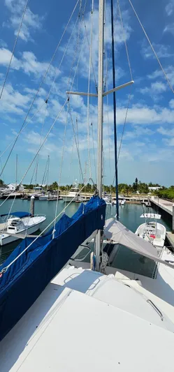  Yacht Photos Pics 1994 Lagoon 42 sailboat docked at marina under clear blue sky.