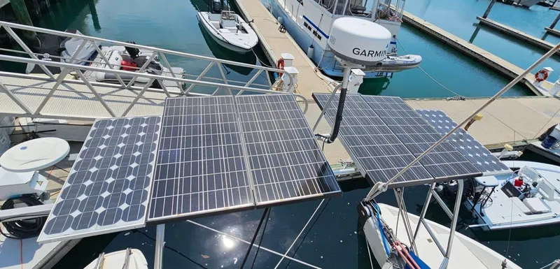  Yacht Photos Pics Solar panels on a 1994 Lagoon 42 catamaran docked at a marina.