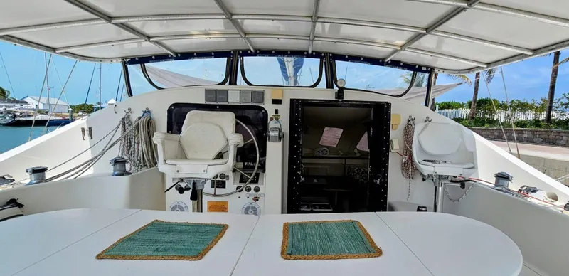  Yacht Photos Pics Lagoon 42 yacht cockpit, 1994 model, featuring dual helm seats and covered deck area.