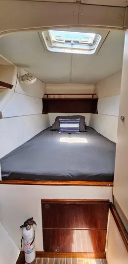  Yacht Photos Pics Cozy cabin interior of 1994 Lagoon 42 catamaran with skylight and bed.