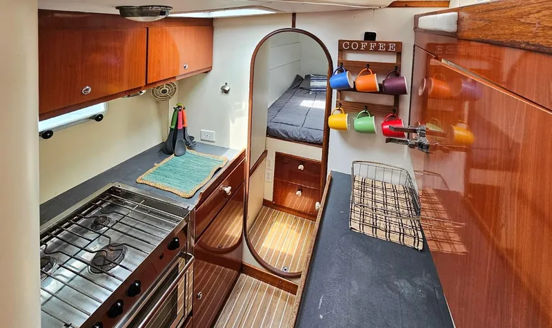  Yacht Photos Pics Interior of 1994 Lagoon 42 yacht with kitchen and cozy sleeping area.