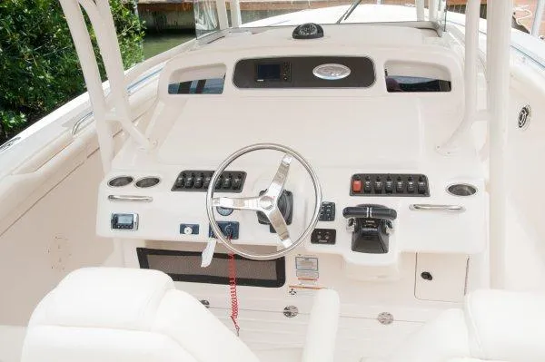  Yacht Photos Pics Manufacturer Provided Image: 2016 Grady-White Canyon 336 boat helm with steering wheel and control panel.