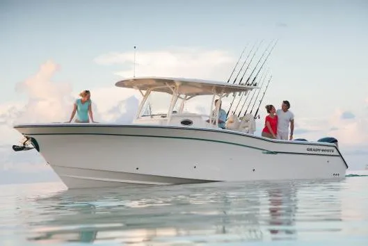  Yacht Photos Pics Manufacturer Provided Image: 2015 Grady-White Canyon 336 boat with people enjoying a calm sea.