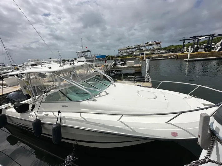  Yacht Photos Pics 2006 Hydra-Sports 2900 VX boat docked at marina under cloudy sky.
