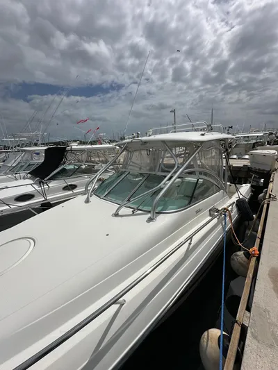  Yacht Photos Pics 2006 Hydra-Sports 2900 VX boat docked at a marina under cloudy skies.