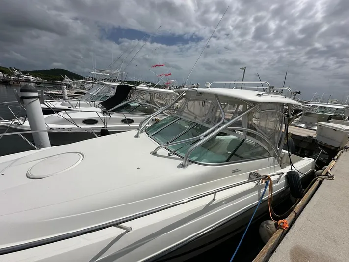  Yacht Photos Pics 2006 Hydra-Sports 2900 VX boat docked at a marina under cloudy skies.