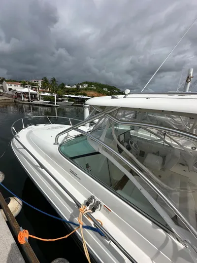  Yacht Photos Pics 2006 Hydra-Sports 2900 VX boat docked at a marina under cloudy skies.