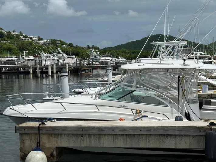  Yacht Photos Pics 2006 Hydra-Sports 2900 VX boat docked at a marina with scenic background.