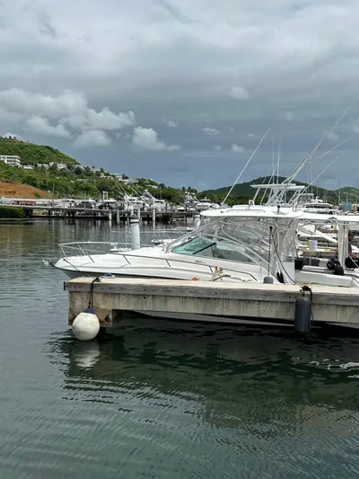  Yacht Photos Pics 2006 Hydra-Sports 2900 VX docked at a marina with scenic hills in the background.