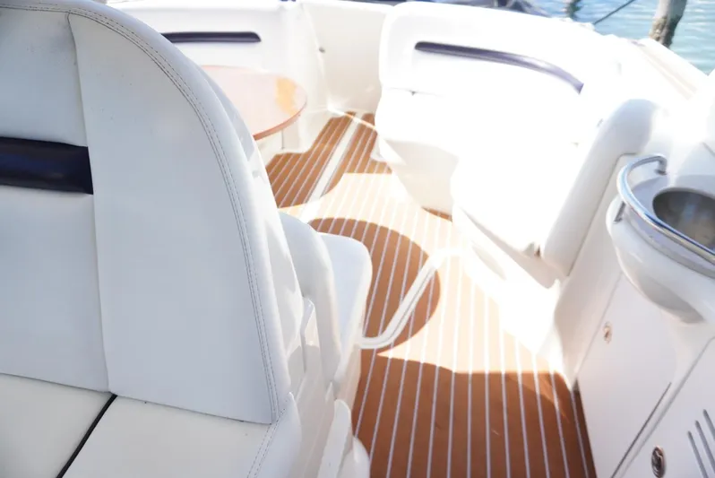  Yacht Photos Pics 2007 Sea Ray 38 Sundancer interior with white seating and wood flooring.